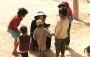 Julie with local children, on the way to Jaisalmer