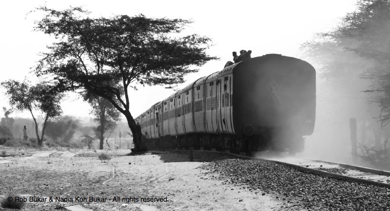 Men Riding on Top of Train